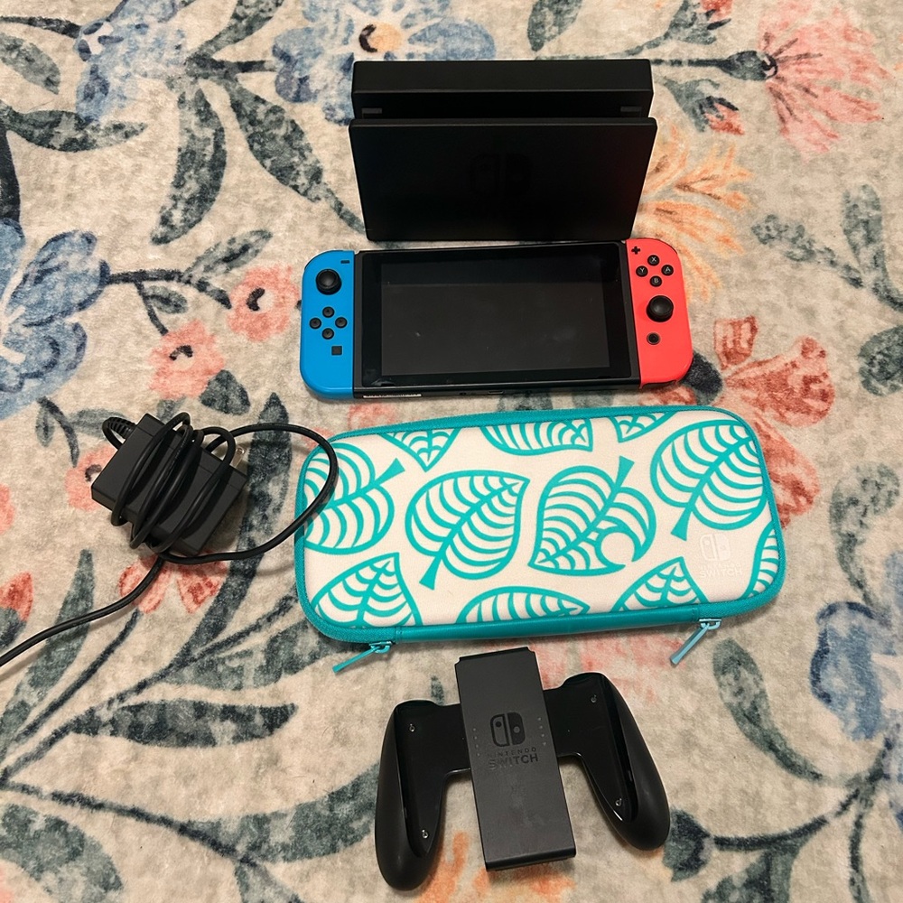 Nintendo Switch 1st Gen with Neon Red and Blue Joy-Con and Animal Crossing Case